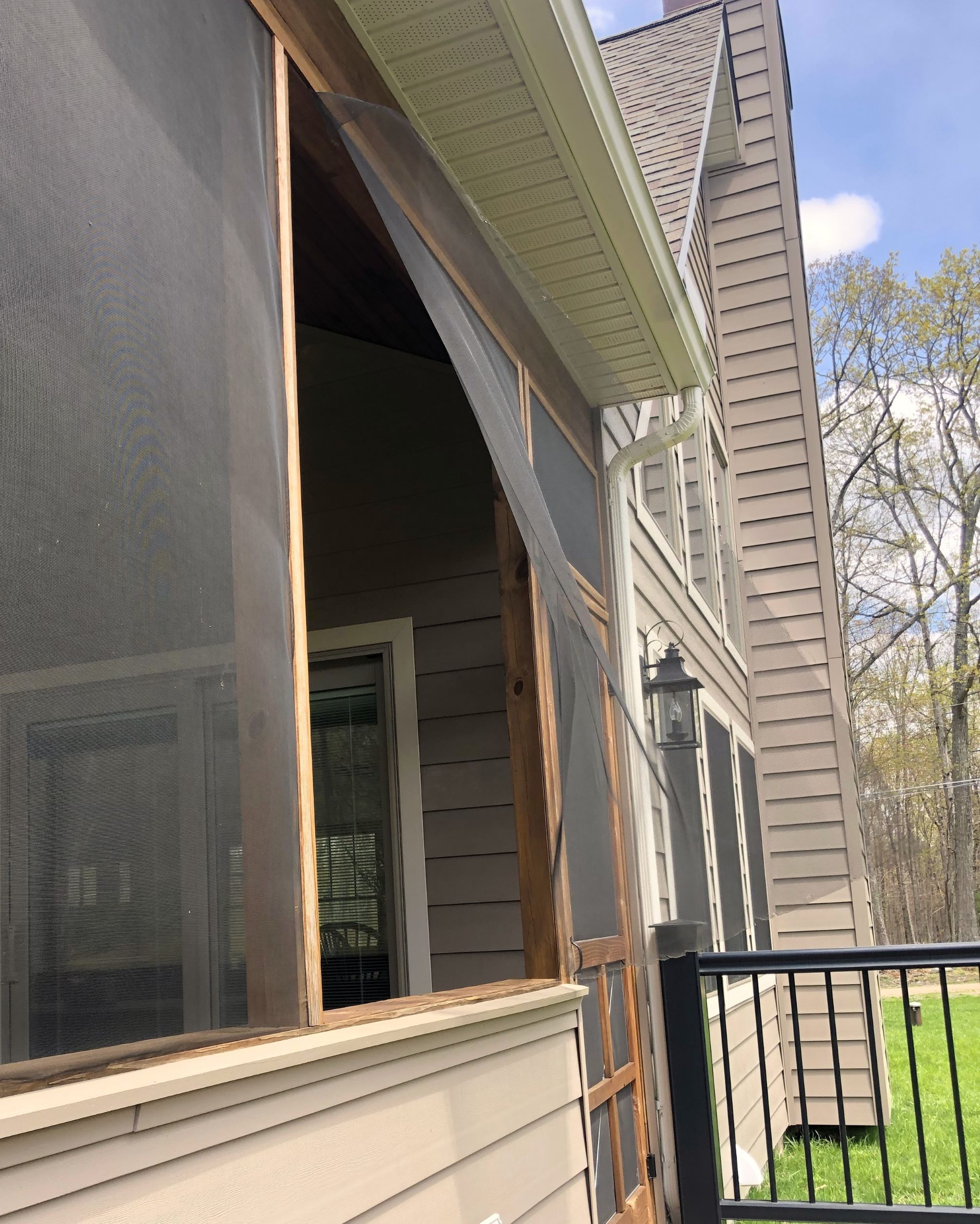 Screen room damage.  Caused by wind, animal or intruder? Screen room damage